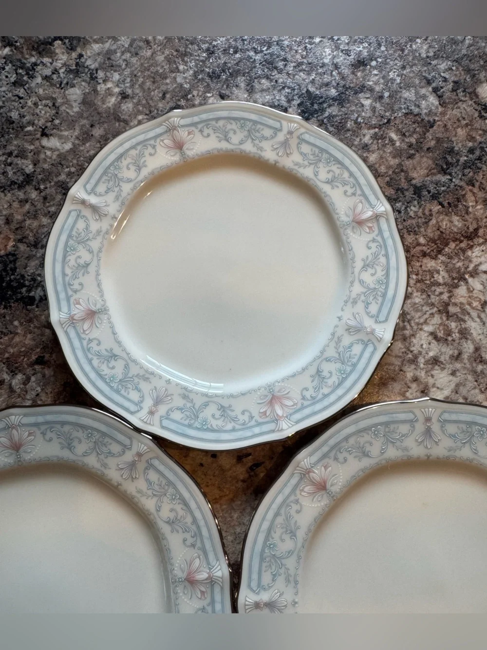 Noritake Crown Flower Dinnerware with Pale Blue and Soft Pink Floral Border